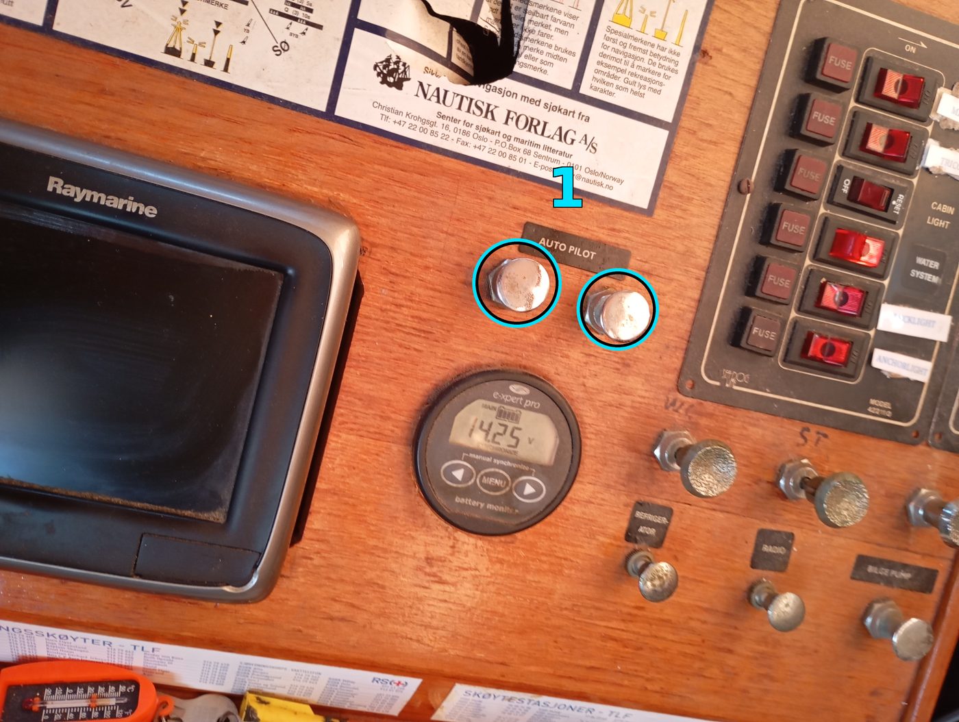 Chart table panel; the two push/pull breakers under the AUTO PILOT label are circled